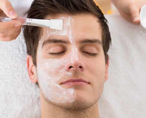 Therapist Applying Face Mask To Man